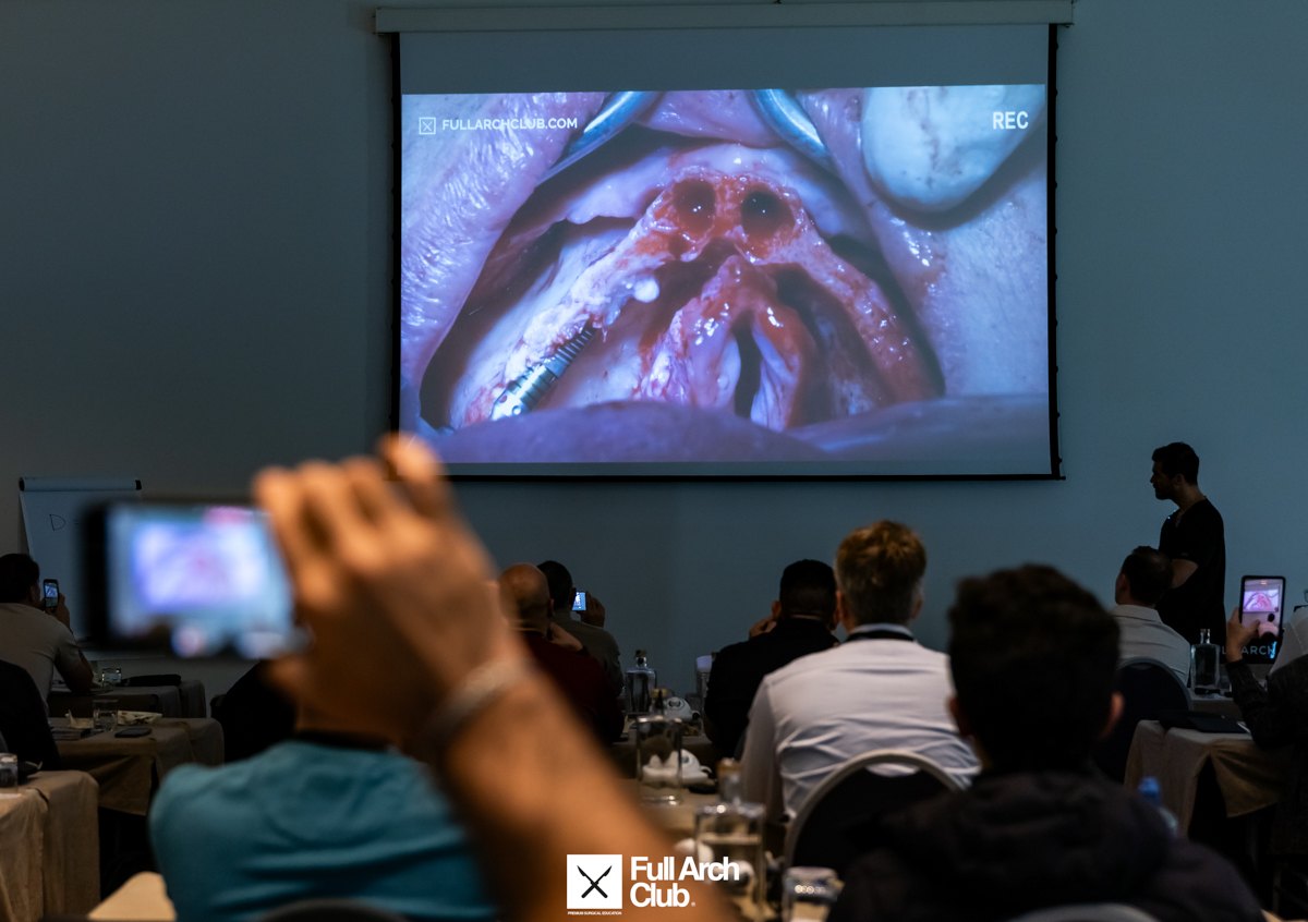 The room following the live surgical field on screen